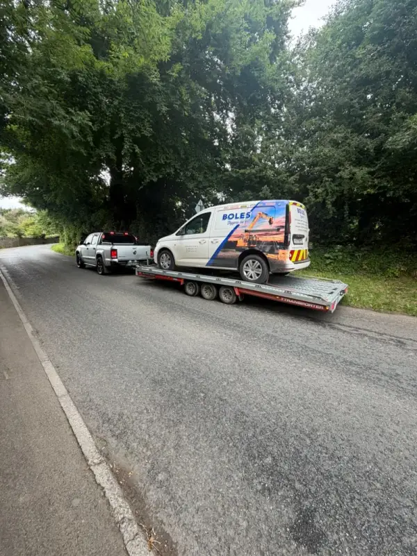 Light commercial van secured on the Healy vehicle transporter